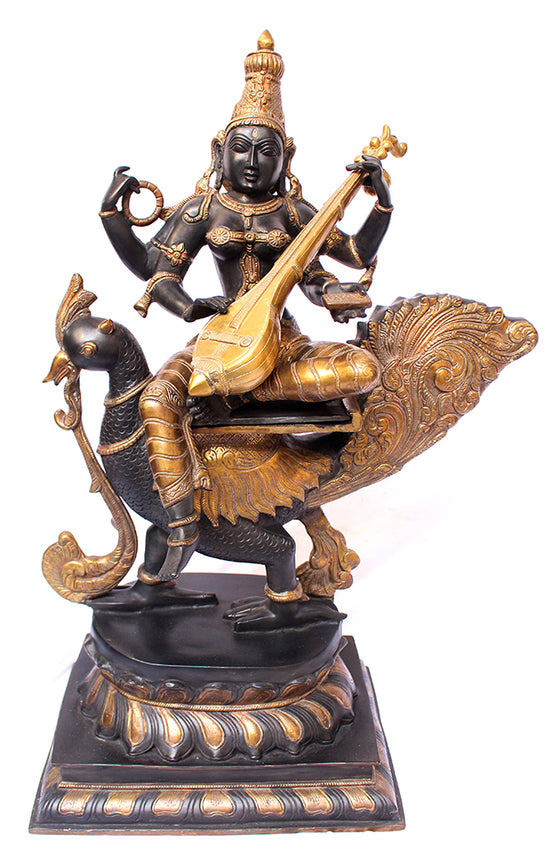 [[Antique black and gold brass Saraswati on a peacock///Saraswati sur un perroquet en laiton noir et doré antique]]