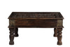 [[Brass decorated wooden coffee table with old carvings and a glass top///Table basse en bois décorée de laiton avec des sculptures anciennes et un plateau en verre]]