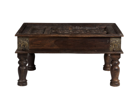 [[Brass decorated wooden coffee table with old carvings and a glass top///Table basse en bois décorée de laiton avec des sculptures anciennes et un plateau en verre]]