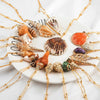 [[Shell pendant with touches of gold///Pendentif en forme de coquillage avec des touches d'or]]