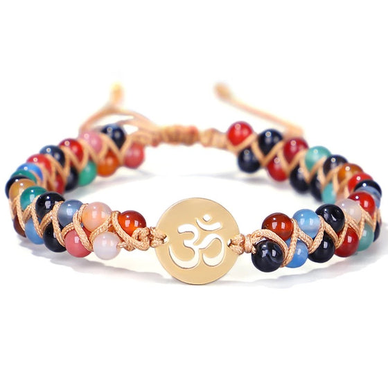 [[Hand braided natural stone bracelet with an OM charm///Bracelet en pierre naturelle tressée à la main avec une breloque OM]]