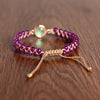[[Hand braided amethyst bracelet with an opal charm///Bracelet tressé à la main en améthyste avec une breloque d'opale]]
