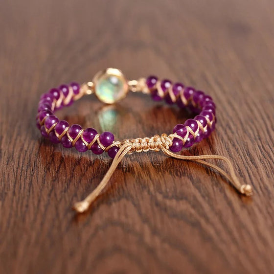 [[Hand braided amethyst bracelet with an opal charm///Bracelet tressé à la main en améthyste avec une breloque d'opale]]